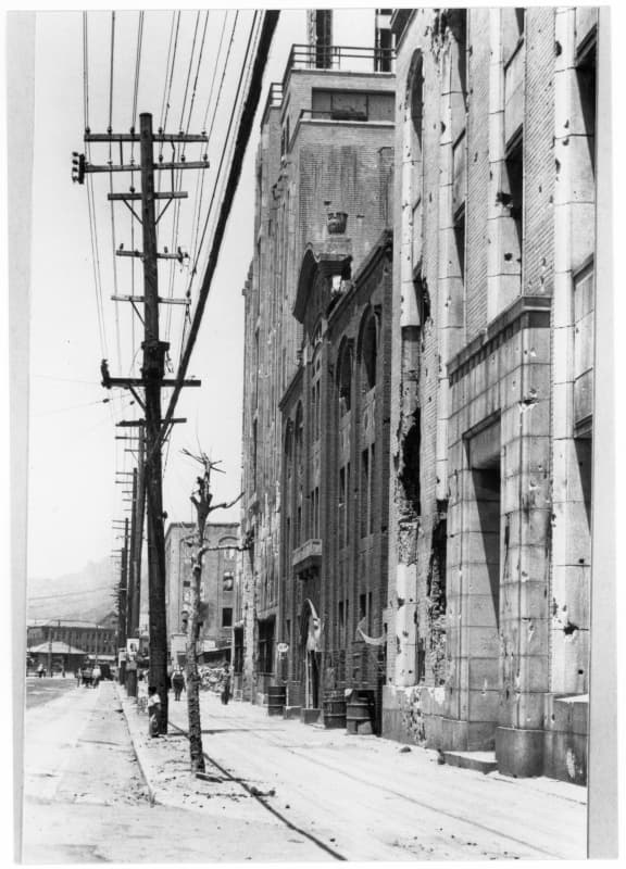A war-damaged street in Seoul, circa 1951. The city visitors see today grew through decades of reconstruction and change.